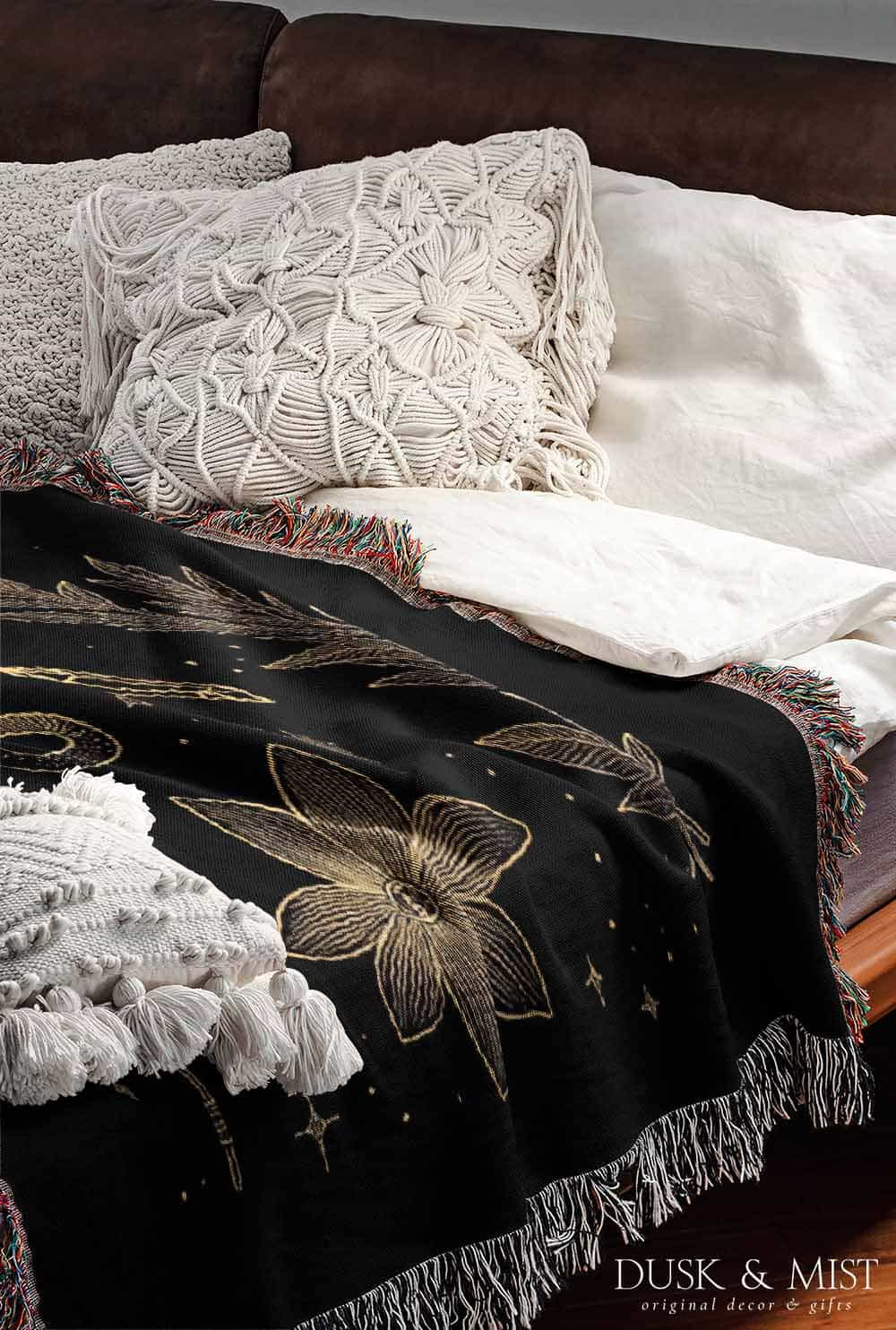 black throw blanket with gold celestial and occult designs