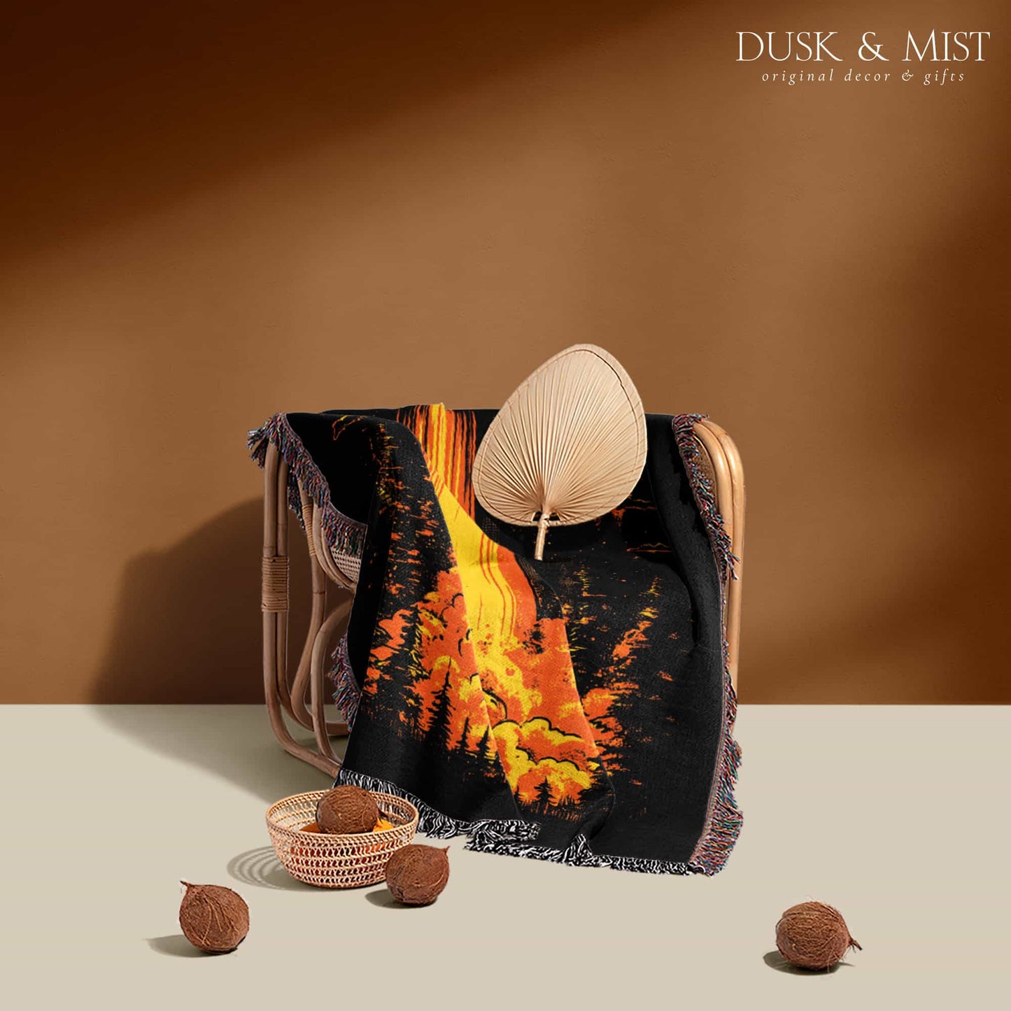 Woven cotton blanket featuring a UFO with a fiery orange beam illuminating a dark forest, with glowing clouds and night sky details.