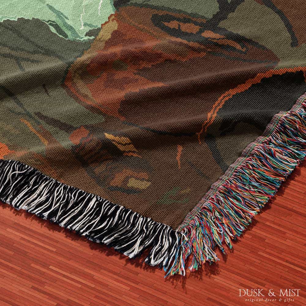 Woven cotton blanket depicting a small ghost and a young girl standing in a warmly lit wooden room filled with plants, books, and soft evening light streaming through a door.