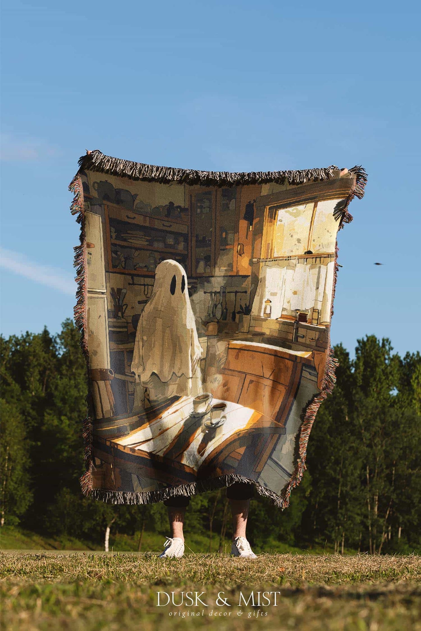 Woven cotton blanket depicting a ghost standing in a vintage kitchen with sunlight streaming through the window onto a wooden table with two teacups.
