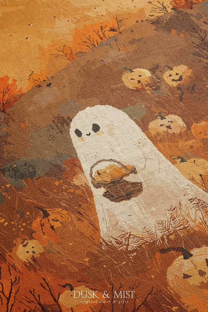 Woven cotton blanket showing a small ghost holding a basket, surrounded by pumpkins and autumn foliage in warm golden and orange tones.