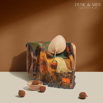 Woven cotton blanket depicting a ghost carrying a basket in a pumpkin-filled autumn field under a twilight sky.  