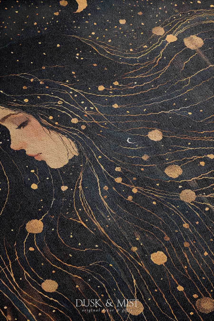 Woven cotton blanket featuring a profile of a woman with flowing hair illustrated as starry constellations, accented with golden moons and celestial motifs on a dark background.