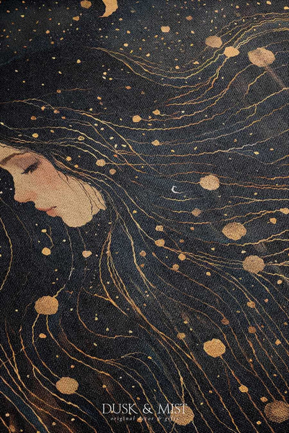 Woven cotton blanket featuring a profile of a woman with flowing hair illustrated as starry constellations, accented with golden moons and celestial motifs on a dark background.