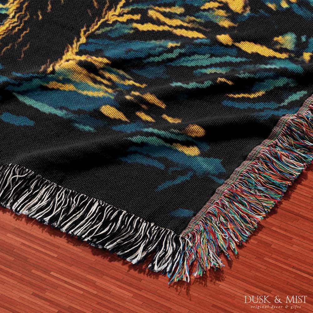 Woven cotton blanket featuring Bigfoot in a forest beneath a Van Gogh-style starry night sky with swirling constellations and moonlight.