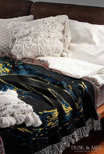 Woven cotton blanket featuring Bigfoot in silhouette against a Van Gogh-style starry night sky with swirling golden stars and dark forest trees.