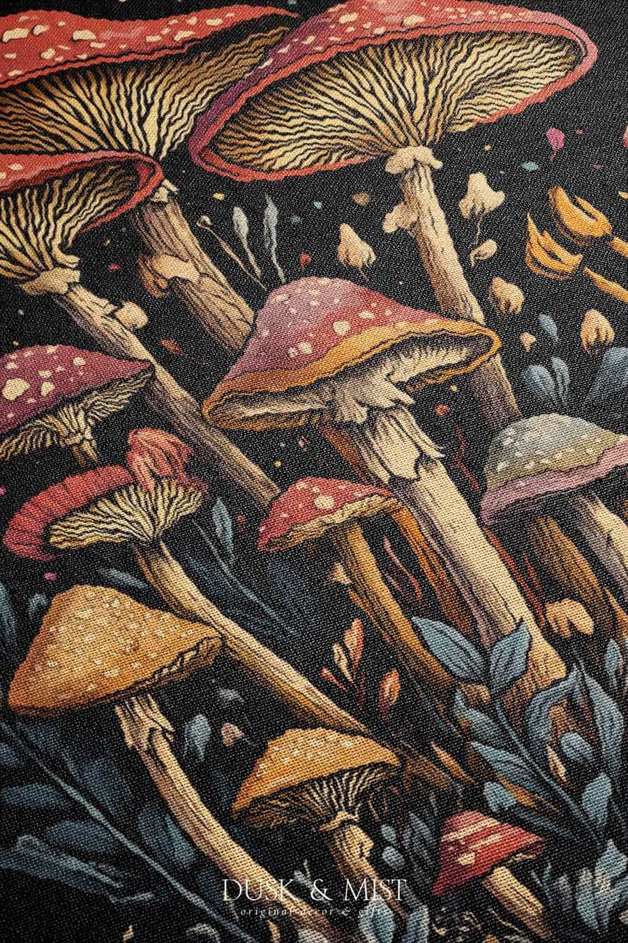 Woven cotton blanket featuring a botanical-style cluster of mushrooms in red, gold, and purple caps surrounded by plants and foliage on a black background.