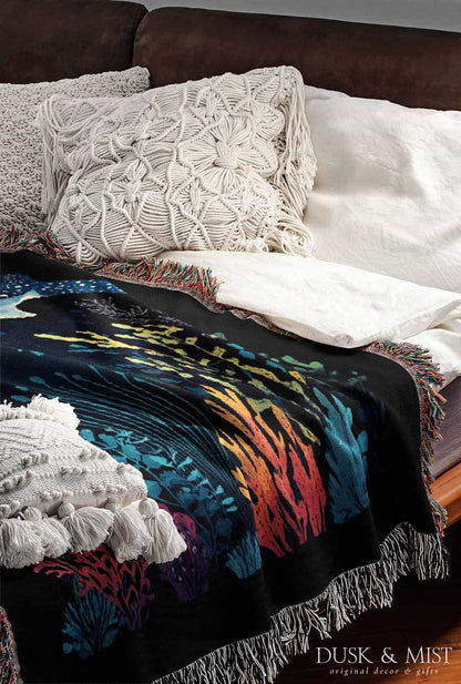 Blanket with whale shark and underwater scene design on a black background