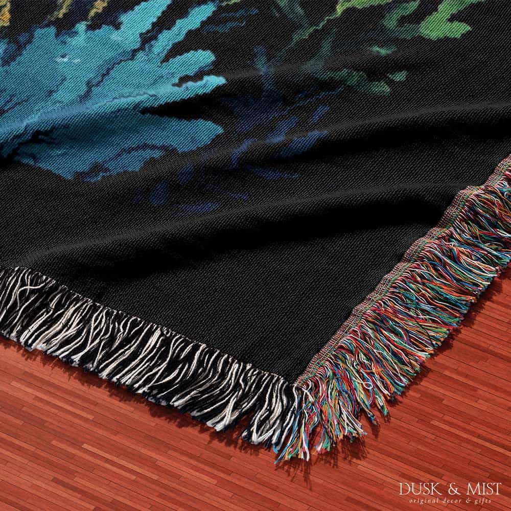 Blanket with whale shark and underwater scene design on a black background