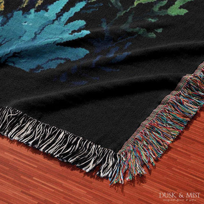 Blanket with whale shark and underwater scene design on a black background