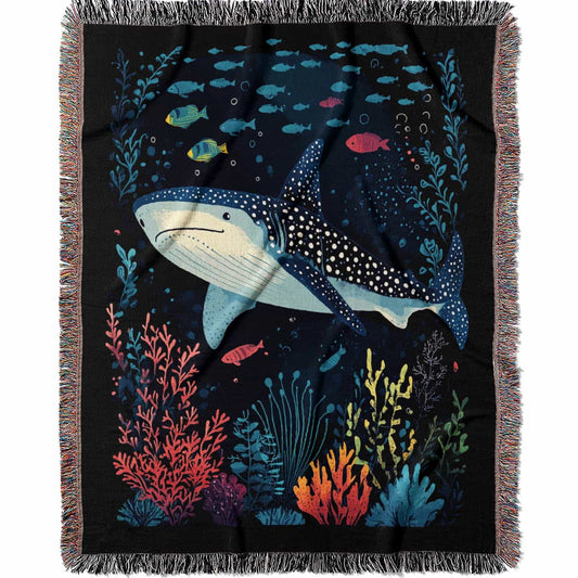 Blanket with whale shark and underwater scene design on a black background