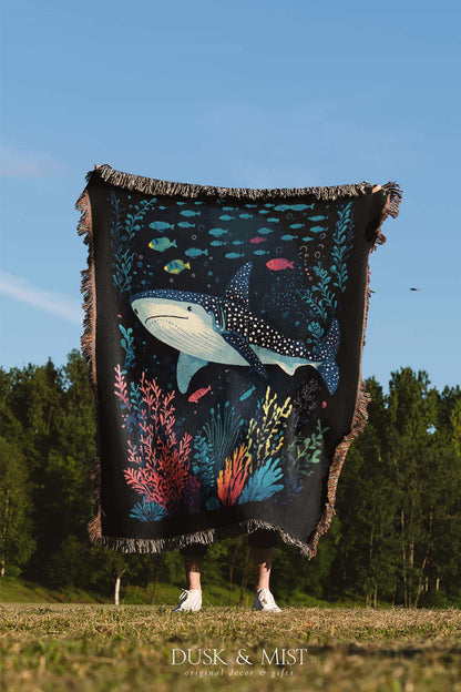 Blanket with whale shark and underwater scene design on a black background