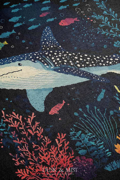 Blanket with whale shark and underwater scene design on a black background
