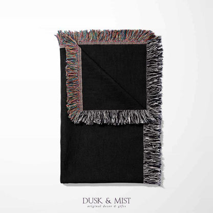 Woven cotton blanket featuring a red dragon wrapped around a golden sword on a black background with intricate wing and scale details.