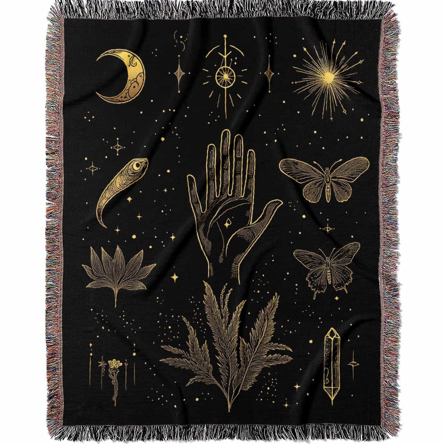 Woven cotton blanket with golden occult illustrations — palmistry hand, crescent moon, moth, snake, crystals, plants, and celestial symbols on a black background.