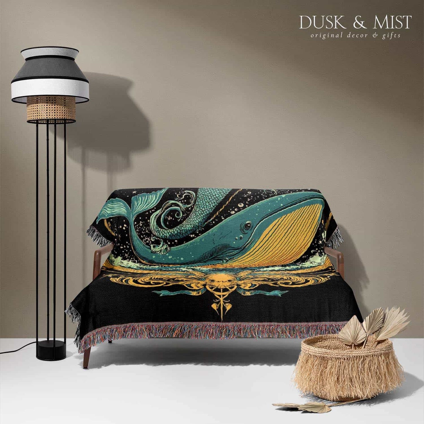 Woven cotton blanket featuring a warrior mermaid with flowing hair riding a whale, holding a spear, surrounded by ornate golden oceanic patterns.
