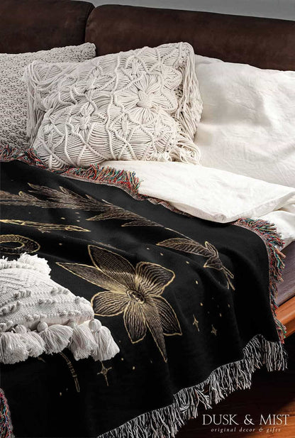black throw blanket with gold celestial and occult designs