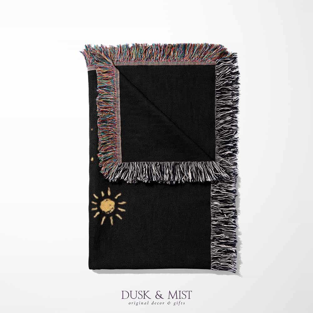 black throw blanket with gold celestial and occult designs