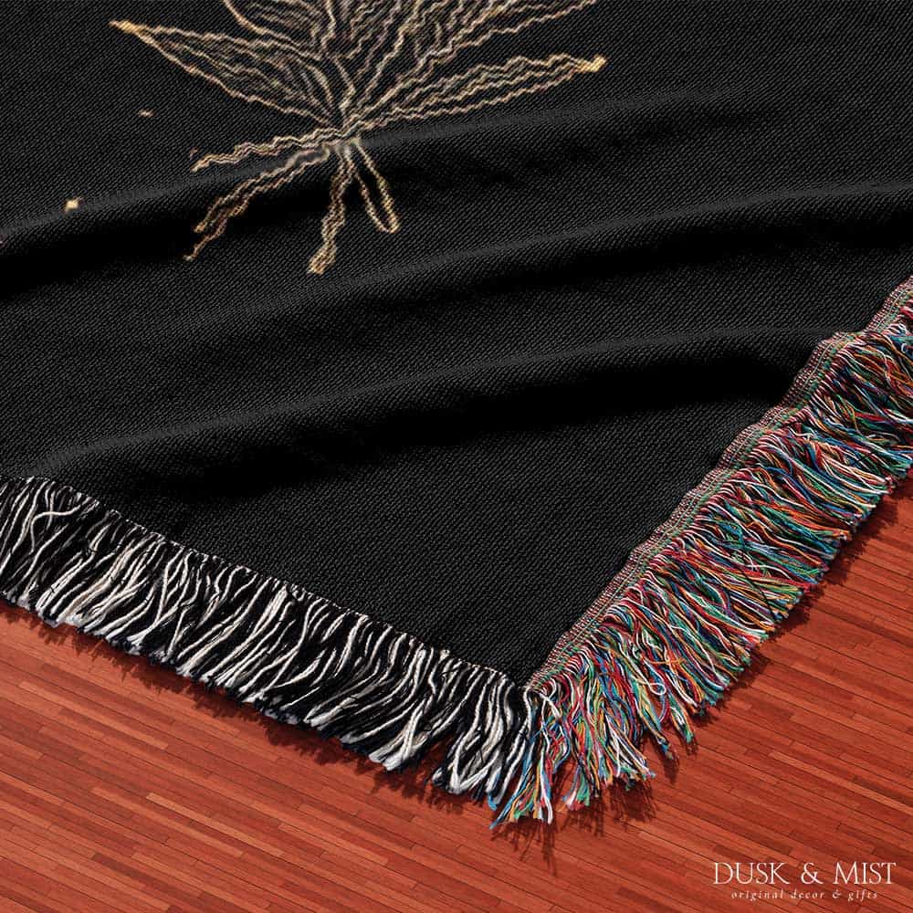 black throw blanket with gold celestial and occult designs
