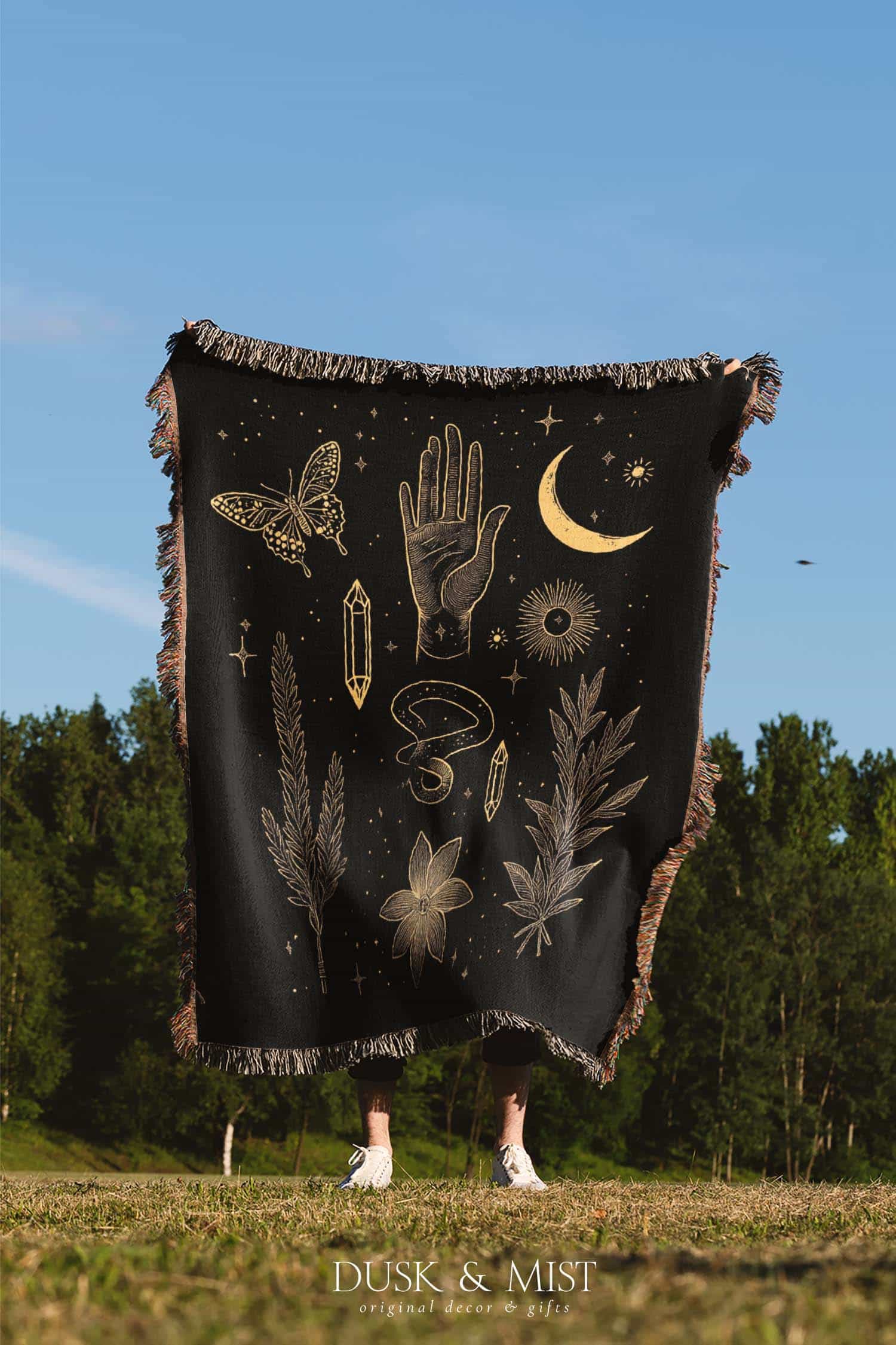 black throw blanket with gold celestial and occult designs