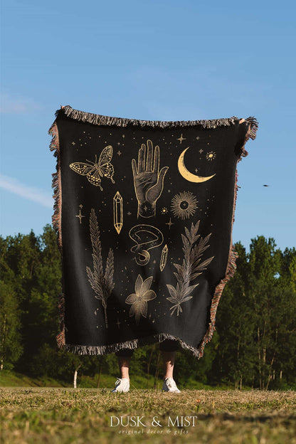 black throw blanket with gold celestial and occult designs