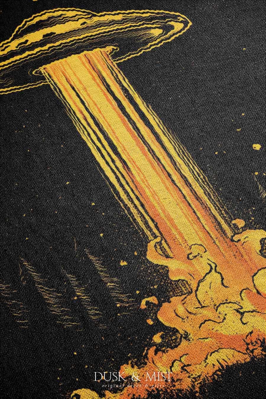 Woven cotton blanket featuring a UFO casting a golden beam into the forest at night, with glowing clouds and cosmic light effects.