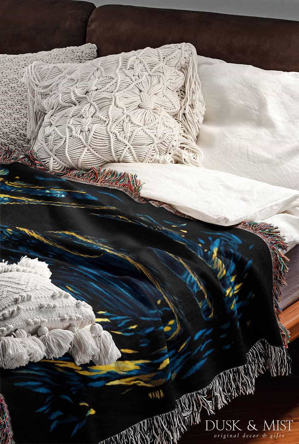 Woven cotton blanket featuring Sasquatch walking through a forest under a Van Gogh-style starry night sky with swirling stars and moonlight.