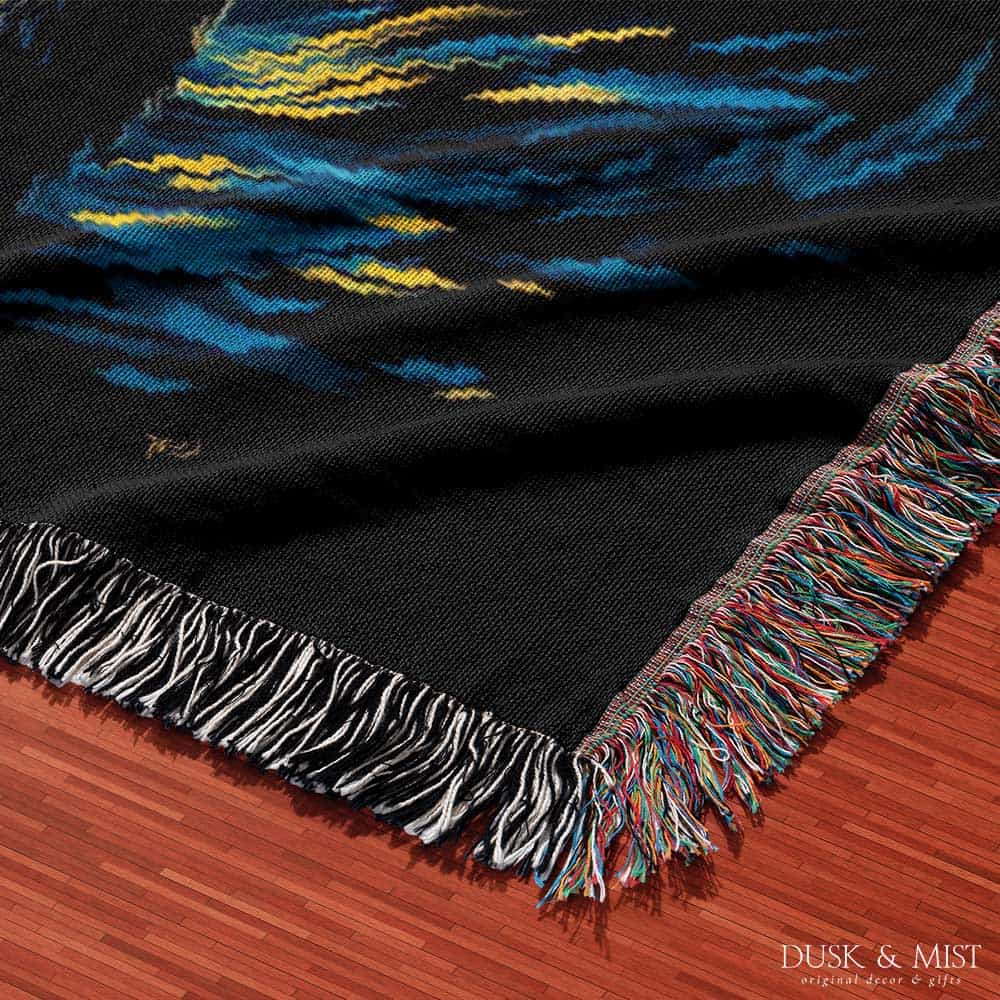 Woven cotton blanket featuring Sasquatch walking through a forest under a Van Gogh-style starry night sky with swirling stars and moonlight.