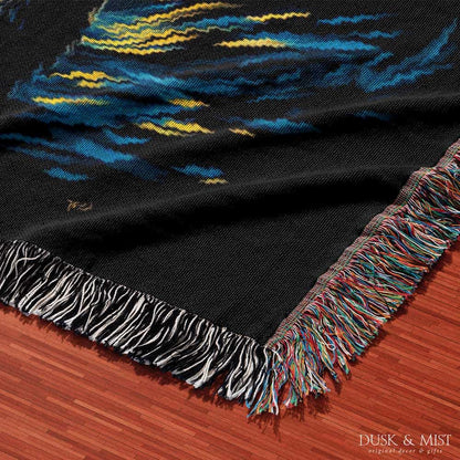 Woven cotton blanket featuring Sasquatch walking through a forest under a Van Gogh-style starry night sky with swirling stars and moonlight.