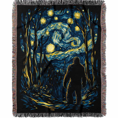 Woven cotton blanket featuring Sasquatch walking through a forest under a Van Gogh-style starry night sky with swirling stars and moonlight.