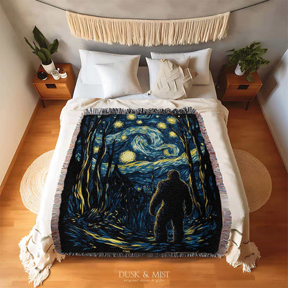 Woven cotton blanket featuring Sasquatch walking through a forest under a Van Gogh-style starry night sky with swirling stars and moonlight.