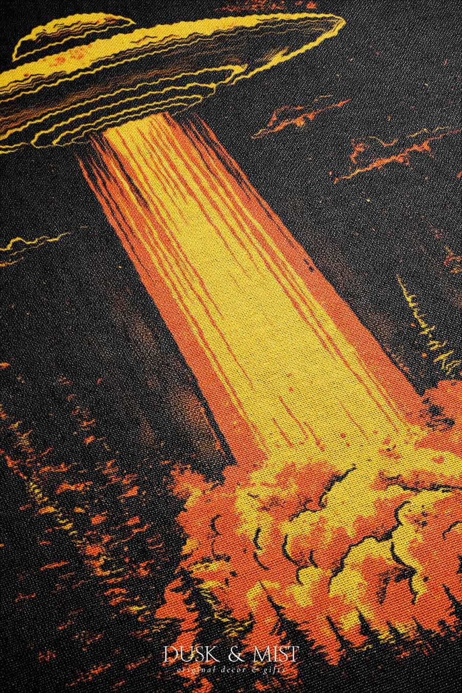 Woven cotton blanket featuring a UFO with a fiery orange beam illuminating a dark forest, with glowing clouds and night sky details.