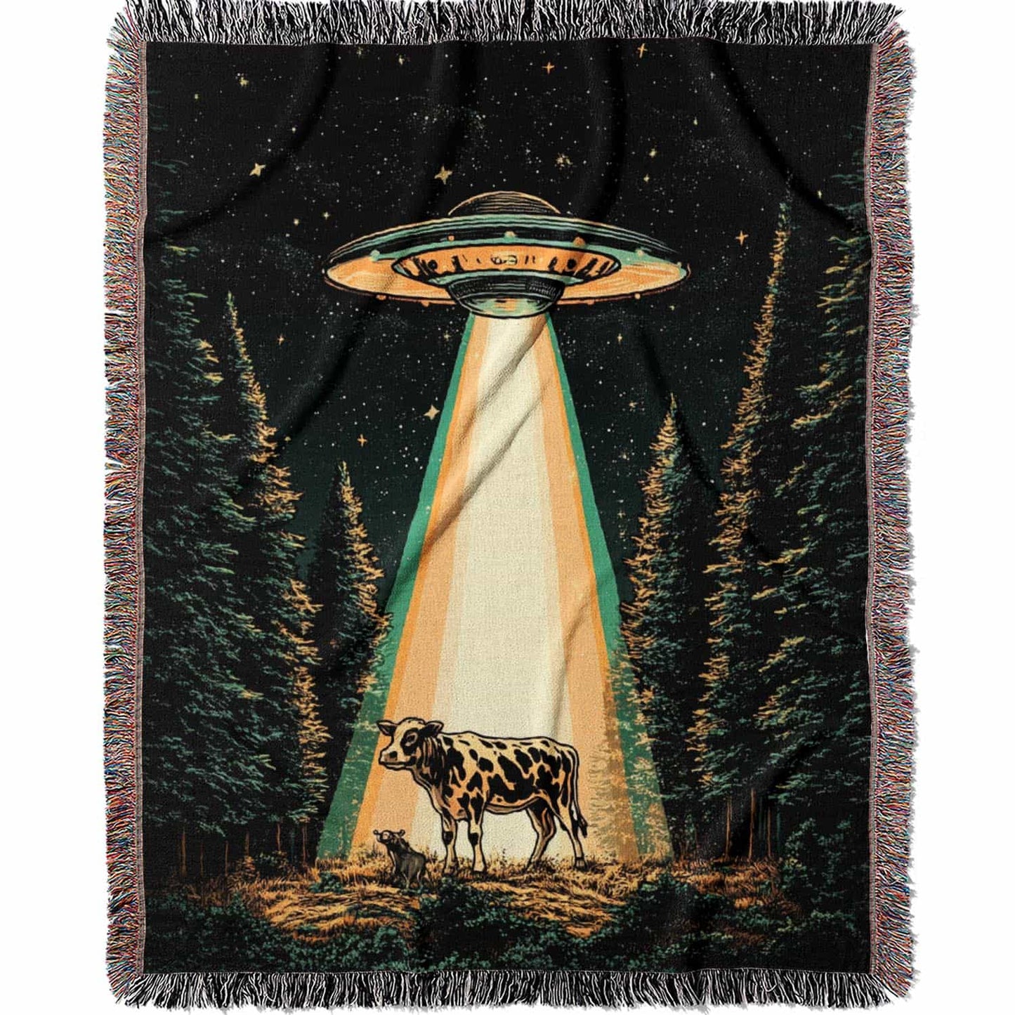 Woven cotton blanket showing a UFO shining a beam of light onto a cow in a forest clearing under a starry night sky.