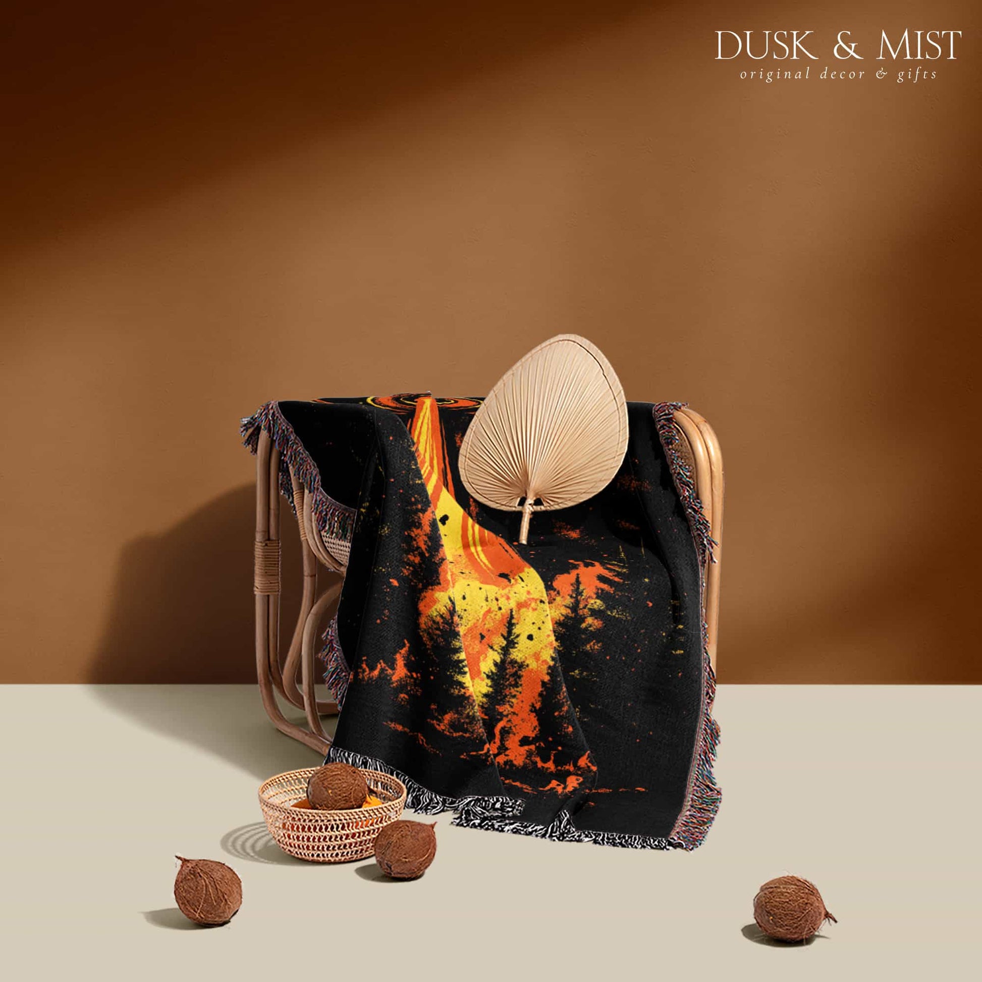Woven cotton blanket featuring a UFO with a fiery orange beam blasting into a dark forest, with glowing explosions and cosmic night details.