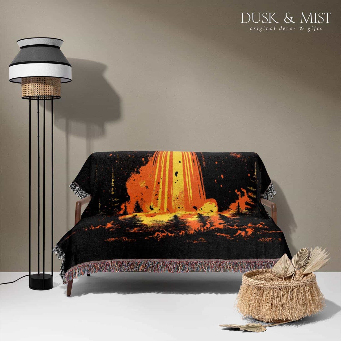Woven cotton blanket featuring a UFO with a fiery orange beam blasting into a dark forest, with glowing explosions and cosmic night details.