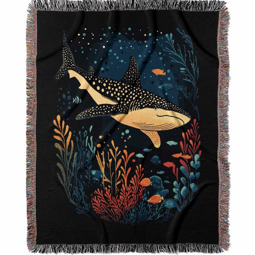 Blanket with whale shark and ocean life design on a black background