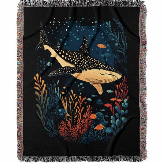 Blanket with whale shark and ocean life design on a black background