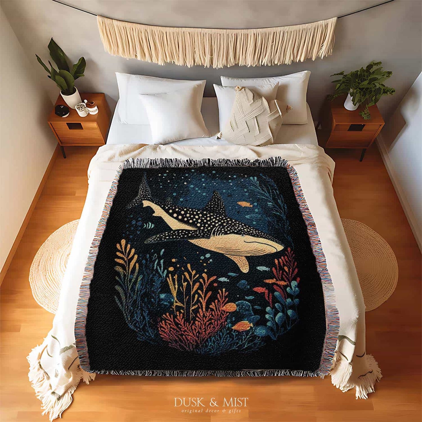 Blanket with whale shark and ocean life design on a black background
